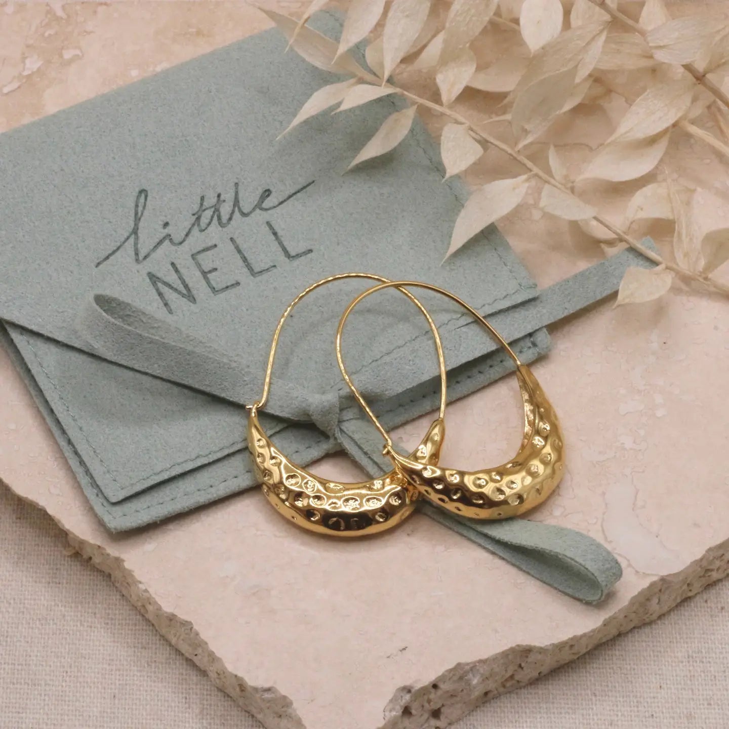 Hammered arc hoop earrings