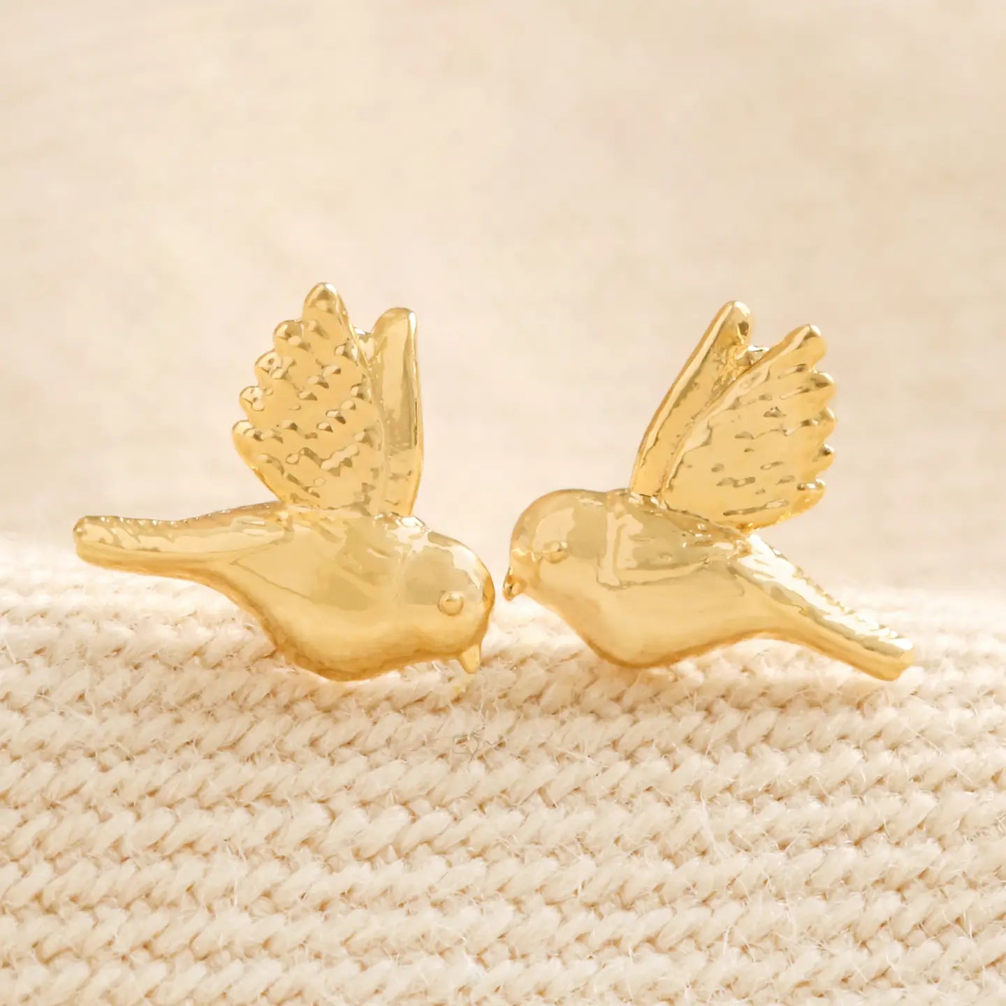 Gold bird stud earrings