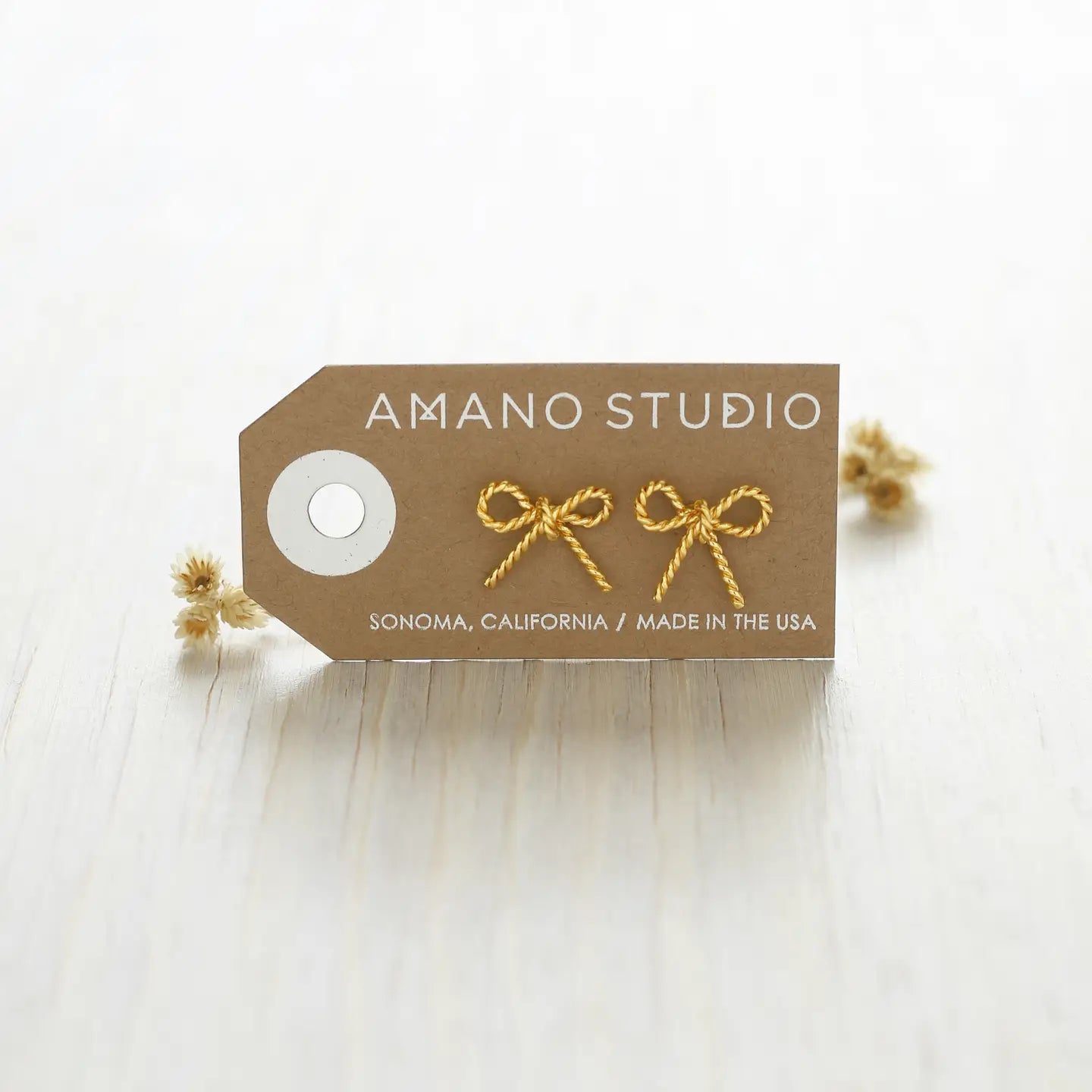 Gold bow stud earrings