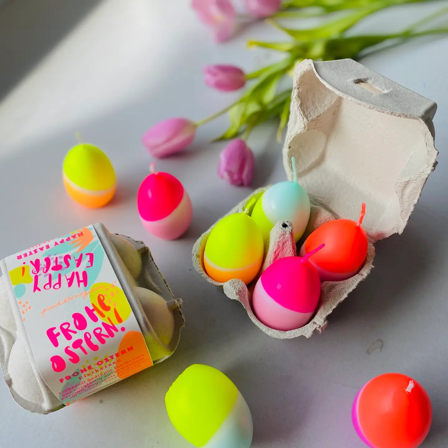 4 neon egg candles in carton