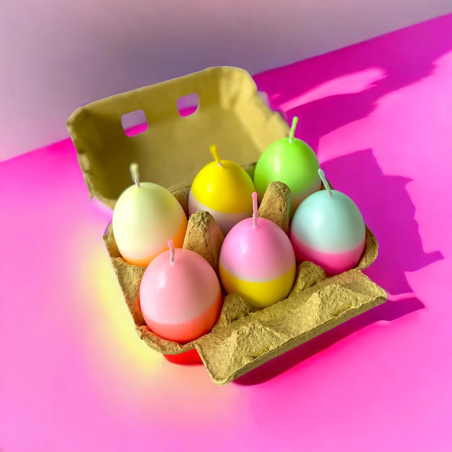 6 neon egg candles in carton