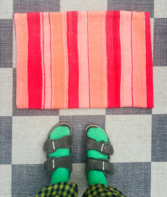 Coral and red stripe cushion