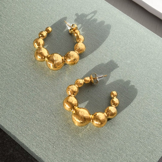 Gold beaded hoop earrings