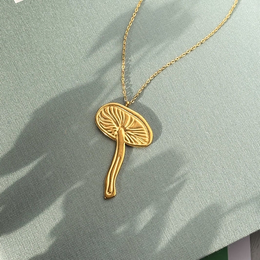 Gold mushroom pendant necklace