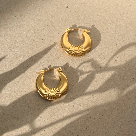 Chunky gold hoops with flower detail