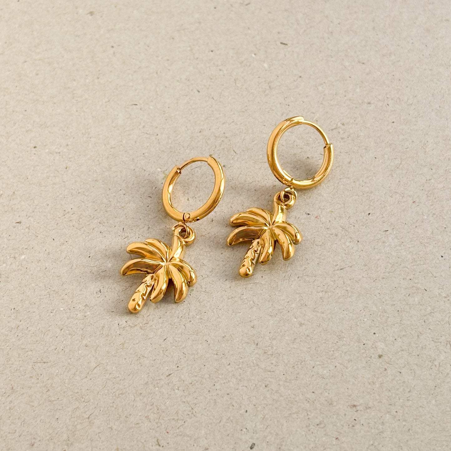 Gold palm tree huggie hoop earrings