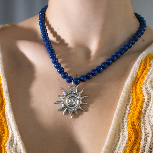 Navy bead and sun pendant necklace