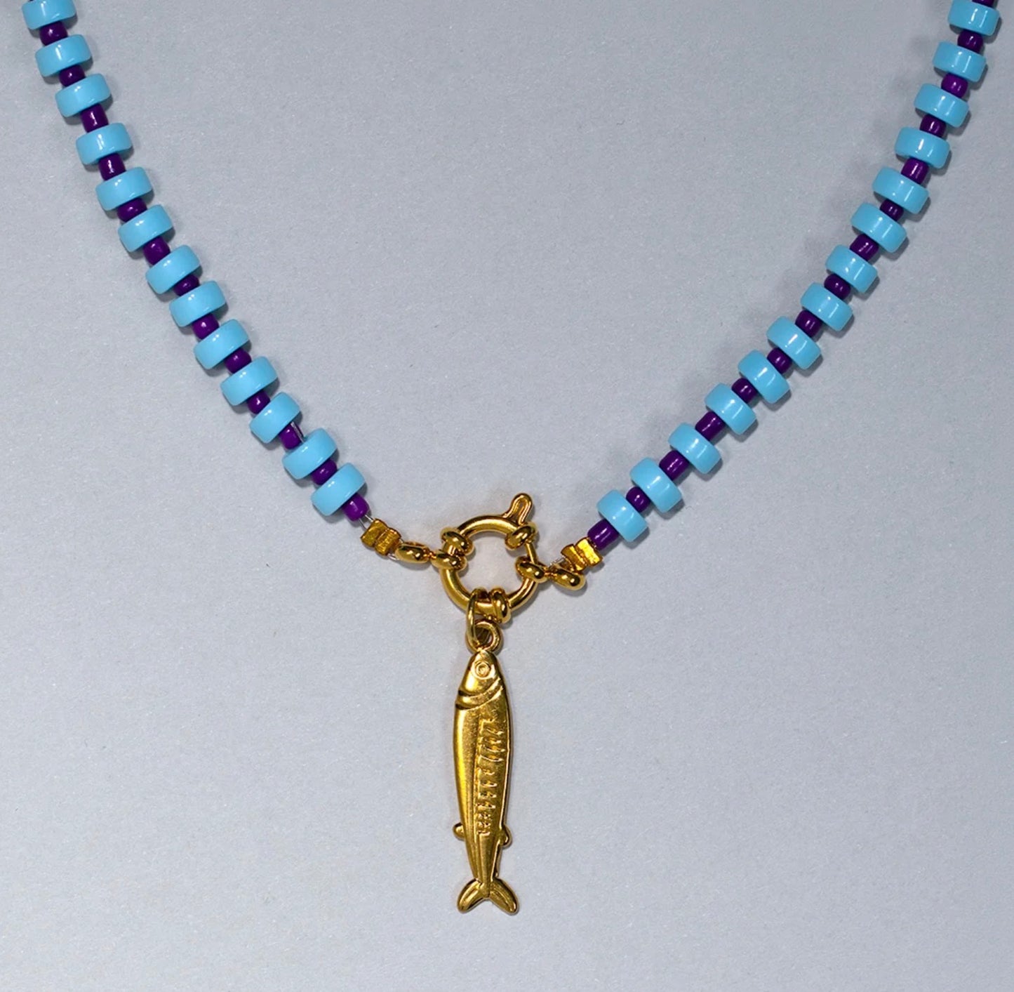 Blue gingham gold fish charm necklace