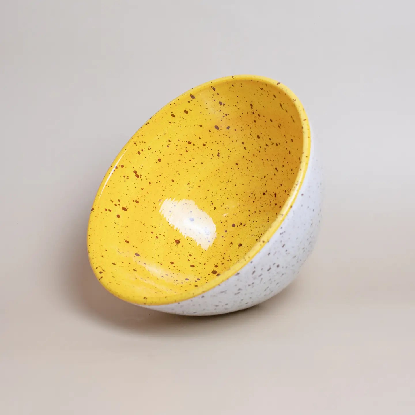 Yellow speckled salad bowl