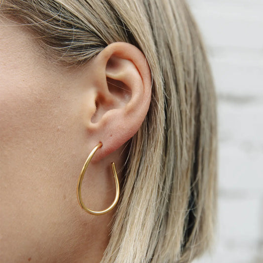 Gold fluid hoop earrings