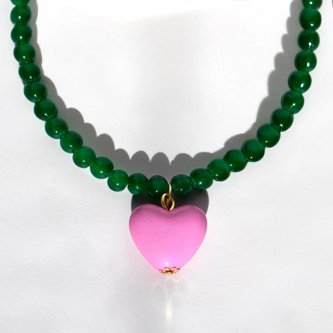 Green bead necklace with pink heart