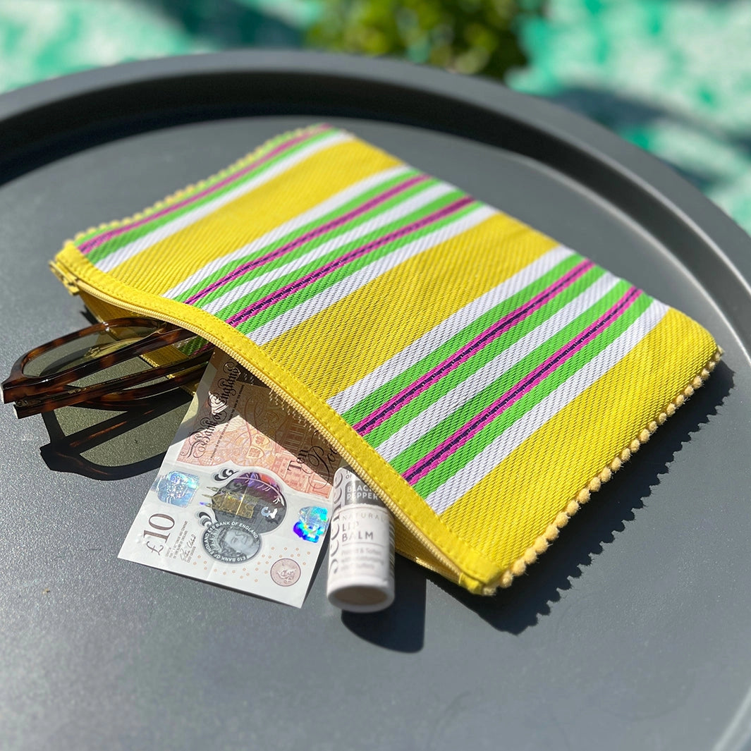 Woven stripy pompom pouch