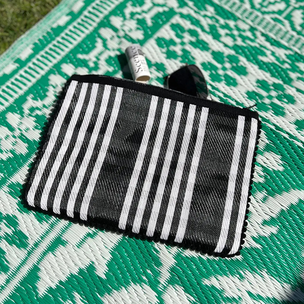 Woven stripy pompom pouch