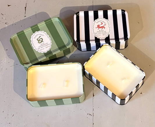 Stripy candle in a tin