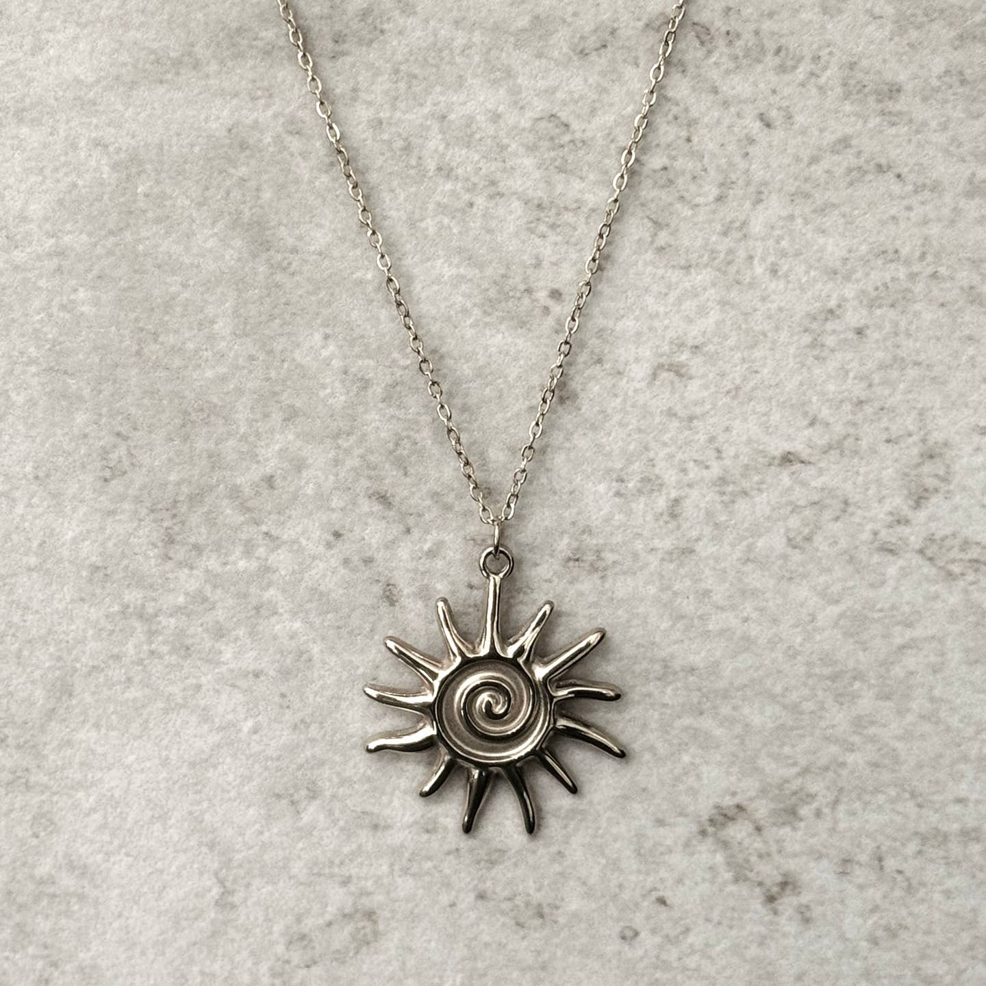Tribal sun pendant necklace