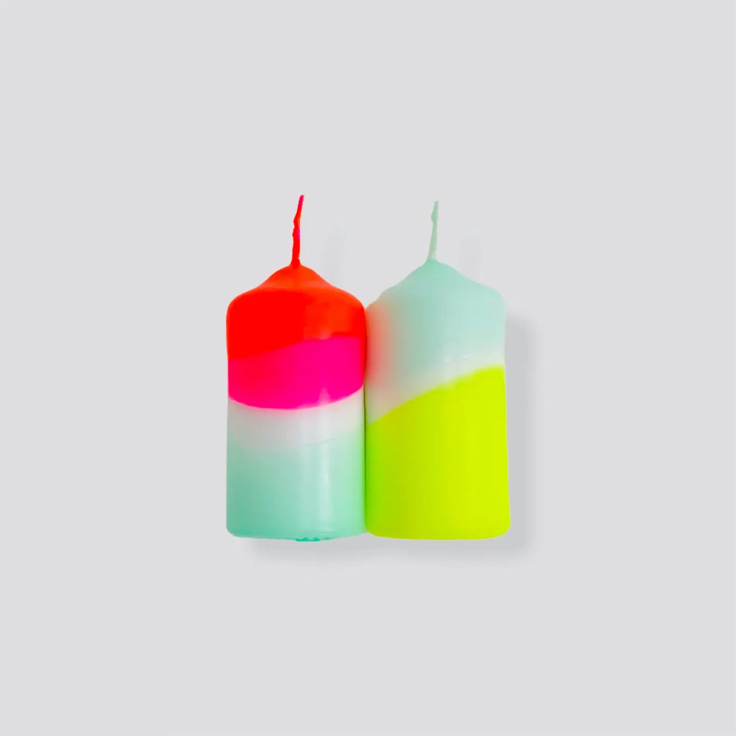 Pair of neon dipped pillar candles